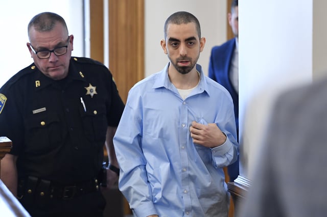 Hadi Matar, right, charged with severely injuring author Salman Rushdie in a 2022 knife attack, is led in to Chautauqua County court in Mayville, New York, Monday, February 10, 2025.