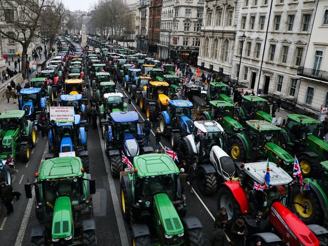LONDON, ENGLAND - FEBRUARY 10: Tractors park in Whitehall during a farmers protest on February 10, 2025 in London, United Kingdom. Farmers are gathering in Westminster to protest changes to inheritance tax, as lawmakers debate a petition with more than 147,000 signatures. The petition calls on the government to abandon reforms introduced in Chancellor Rachel Reeve's Autumn Budget, which farmers say will "devastate farms nationwide." The government has said the inheritance tax reforms are necessary to restore economic stability, and will affect approximately 500 estates per year from April 2026, when the changes are set to take effect. (Photo by Alishia Abodunde/Getty Images)