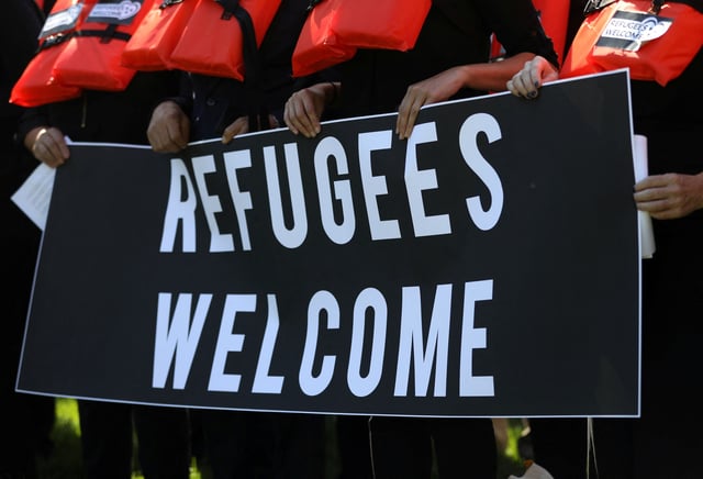 People protest against planned Trump administration cuts to the U.S. refugee resettlement program, in front of the U.S. Capitol Building in Washington, U.S., October 15, 2019. REUTERS/Leah Millis/File Photo