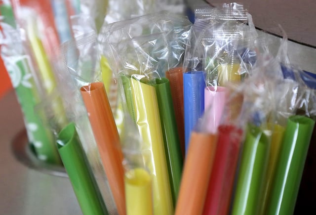FILE - Wrapped plastic straws are seen at a bubble tea cafe in San Francisco, July 17, 2018. (AP Photo/Jeff Chiu, File)