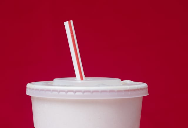 FILE- A large soft drink with a plastic straw from a McDonald's restaurant is shown in Surfside, Fla., May 24, 2018. (AP Photo/Wilfredo Lee, File)