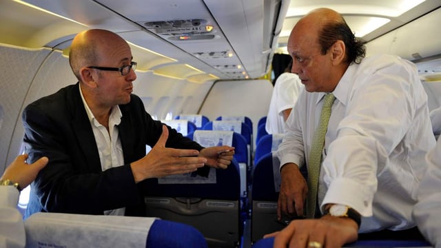 Sean O’Neill and Asil Nadir, right, on board the plane that took the former boss of Polly Peck back to the UK