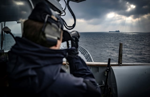 A NATO Baltic Sea patrol mission tracks a cargo ship on the horizon near Karlskrona, Sweden