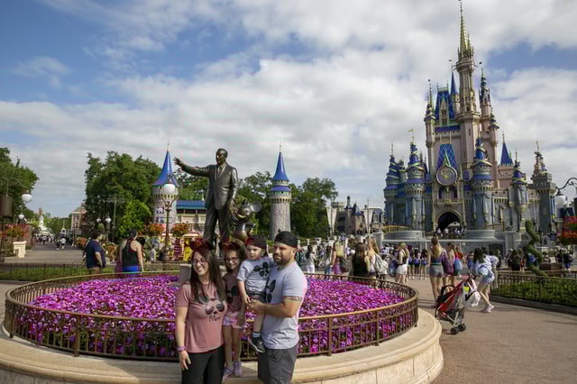 People visit Magic Kingdom Park at Walt Disney World Resort in Lake Buena Vista, Florida, on Friday, April 22, 2022.