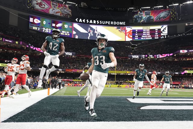 Philadelphia Eagles' Cooper DeJean celebrates after intercepting a pass and running it back for a touchdown during the Super Bowl game against the Kansas City Chiefs.
