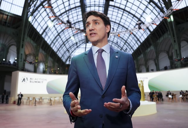 Prime Minister Justin Trudeau speaks to reporters as he arrives to the Artificial Intelligence Action Summit at the Grand Palais in Paris, France on Tuesday, Feb. 11, 2025. 