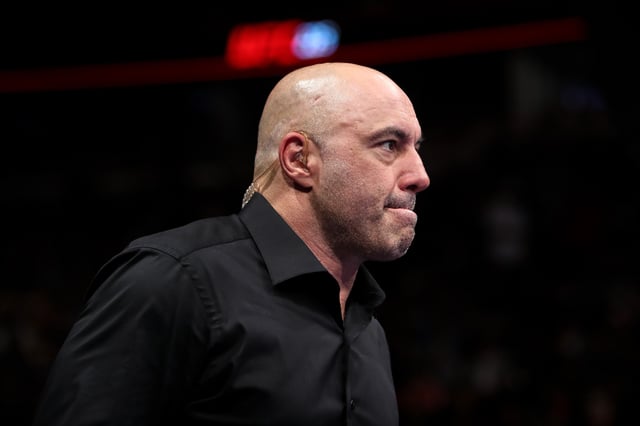 Joe Rogan enters the octagon during the UFC 225: Whittaker v Romero 2 event at the United Center on June 9, 2018 in Chicago, Illinois.