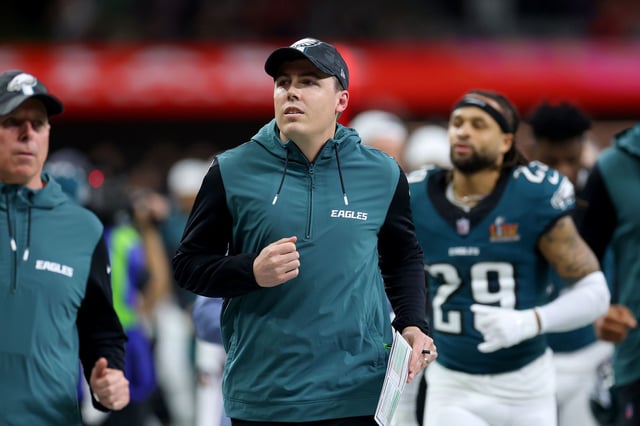 Offensive coordinator Kellen Moore jogs off the field at halftime before the Philadelphia Eagles' Super Bowl LIX victory over the Kansas City Chiefs at Caesars Superdome in New Orleans.