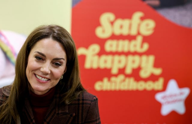 Catherine, Princess of Wales, smiles during a visit to a mother and baby unit at Styal prison in north-west England