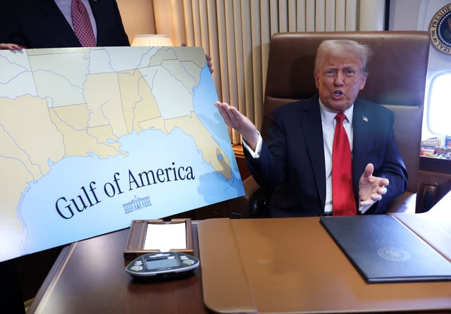 U.S. President Donald Trump speaks to reporters after signing a proclamation renaming the Gulf of Mexico to the Gulf of America, while flying over the gulf aboard Air Force One en route to New Orleans to attend the Super Bowl, February 9,  2025. REUTERS/Kevin Lamarque/File Photo