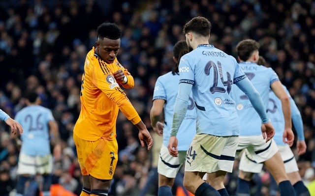 Soccer Football - Champions League - Knockout Phase Playoff - First Leg - Manchester City v Real Madrid - Etihad Stadium, Manchester, Britain - February 11, 2025  Real Madrid's Vinicius Junior and Manchester City's Josko Gvardiol REUTERS/Phil Noble