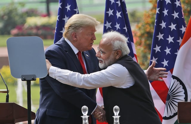 U.S. President Donald Trump and Indian Prime Minister Narendra Modi embrace after giving a joint statement in New Delhi, India, Feb. 25, 2020. (AP Photo/Manish Swarup, File)