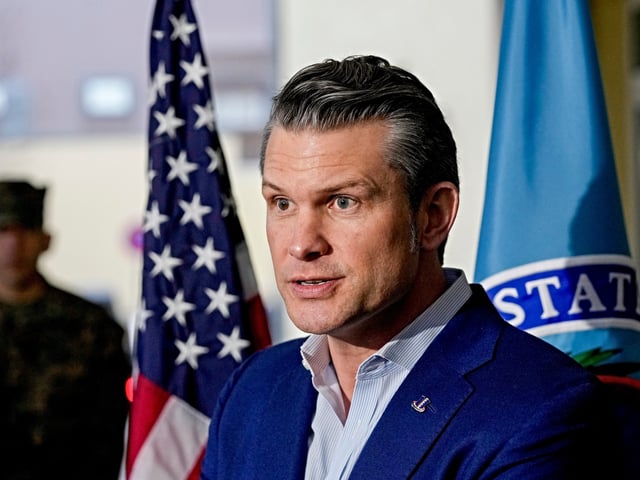 US Secretary of Defense Pete Hegseth talks to the media during his visit to the headquarters of U.S. European Command and Africa Command at the Africa Command at Kelly Barracks in Stuttgart Germany, Tuesday, Feb. 11, 2025. (AP Photo/Michael Probst)