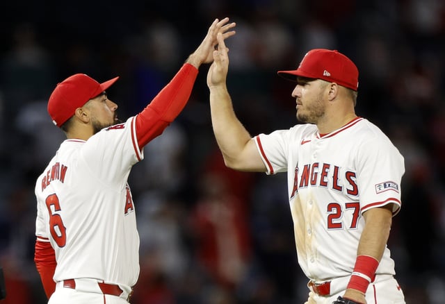 Mike Trout #27 and Anthony Rendon #6 of the Los Angeles Angels celebrates a 7-1 win over the Tampa Bay Rays at Angel Stadium of Anaheim on April 8, 2024 in Anaheim, California