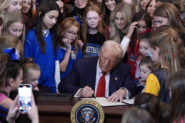 President Donald Trump signs an executive order barring transgender female athletes from competing in women&#39;s or girls&#39; sporting events, in the East Room of the White House, Wednesday, February 5, 2025, in Washington.