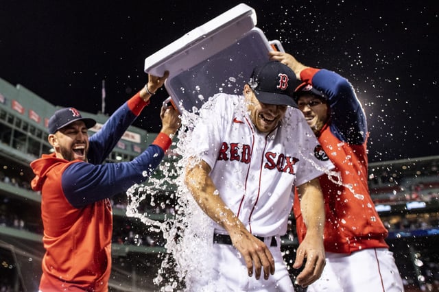 Nick Pivetta #37 of the Boston Red Sox reacts as he is doused with water after pitching a complete game against the Houston Astros on May 18, 2022 at Fenway Park in Boston, Massachusetts.
