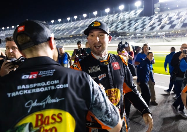 Chase Briscoe celebrates with teammates after winning the pole during qualifying for the Daytona 500.