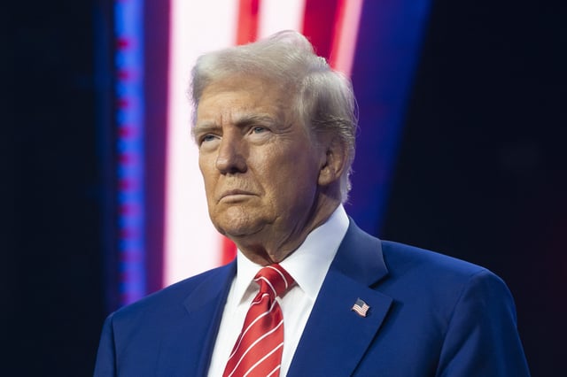 Donald Trump looks on during Turning Point USA&#39;s AmericaFest at the Phoenix Convention Center on December 22, 2024 in Phoenix, Arizona.