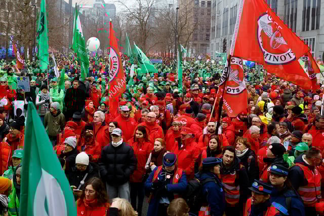 Workers and members of trade unions hold flags during a national strike demanding stronger public services in Brussels, Belgium February 13, 2025. REUTERS/Stephanie Lecocq