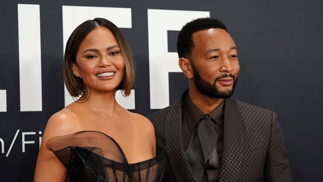 Chrissy Teigen, left, and John Legend arrive at the 67th annual Grammy Awards on Sunday, Feb. 2, 2025, in Los Angeles. (Photo by Jordan Strauss/Invision/AP)