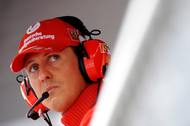 Former Ferrari driver Michael Schumacher of Germany looks on during the qualifying session for the Italian F1 Grand Prix race at the Monza racetrack in Monza, near Milan, in this September 13, 2008 file photo. REUTERS/Alessandro Bianchi/File Photo