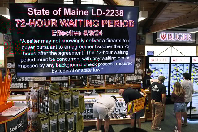 FILE - Customers shop in the firearms section at the Kittery Trading Post, Aug. 9, 2024, in Kittery, Maine. (AP Photo/Charles Krupa, File)