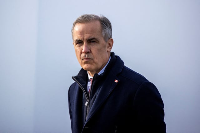 Former Bank of Canada and Bank of England governor, and current Liberal Party leadership candidate, Mark Carney looks on before delivering remarks at the still-under-construction Gordie Howe International Bridge in Windsor, Ontario, Canada, February 5, 2025. REUTERS/Carlos Osorio/File Photo