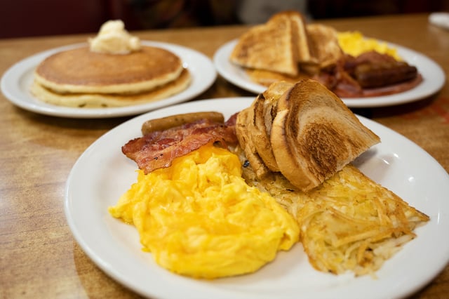 The All-American Slam (front) and the Lumberjack Slam (back) inside Denny’s on Mission Street in San Francisco, Nov. 15, 2022.
