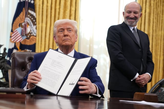 U.S. President Donald Trump, joined by Secretary of Commerce Howard Lutnick, delivers remarks after signing an executive order on reciprocal tariffs in the Oval Office at the White House on February 13, 2025 in Washington, DC.