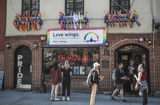 FILE - Pride flags and colors display on the Stonewall Inn bar, marking the site of 1969 riots that followed a police raid of the bar's gay patrons, June 3, 2019, in New York. (AP Photo/Bebeto Matthews, File)