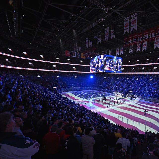 MONTREAL, CANADA - FEBRUARY 13: Players stand at attention during the national anthem prior to Team USA vs. Team Finland in the NHL 4 Nations Face-Off at Bell Centre on February 13, 2025 in Montreal, Quebec, Canada.  (Photo by Minas Panagiotakis/Getty Images)