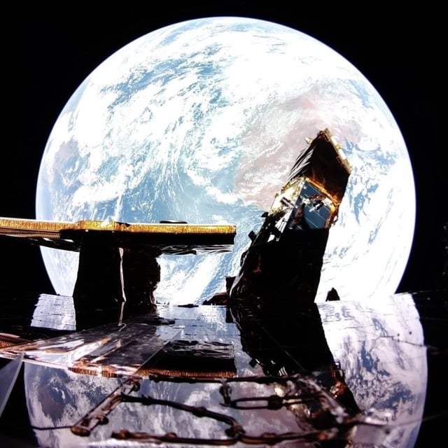 Firefly Aerospace's Blue Ghost lander reflects Earth with its mirror-smooth solar panel in space. 