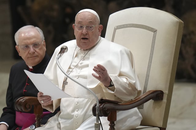 Pope Francis starts reading his speech during his weekly general audience in the Paul VI Hall, at the Vatican, Wednesday, Feb. 12, 2025. (AP Photo/Alessandra Tarantino)
