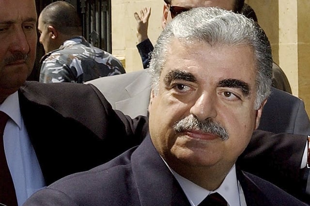 FILE - Lebanese Prime Minister-designate Rafik Hariri leaves the Parliament building in Beirut, Lebanon, on April 17, 2003. (AP Photo/File)