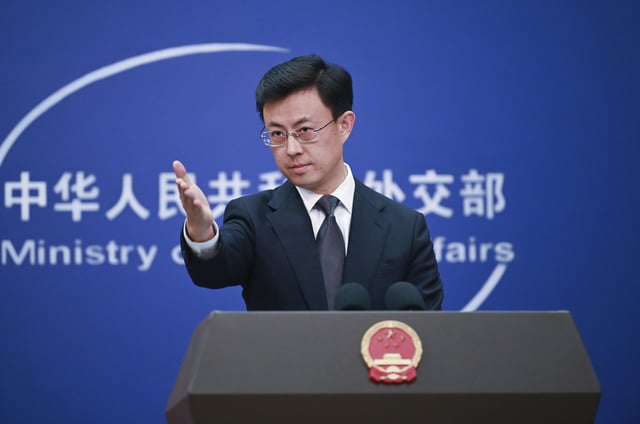 Guo Jiakun, spokesman for the Chinese Foreign Ministry, answers questions from journalists during the daily press conference on January 21.