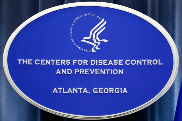 A sign with the logo for the Centers for Disease Control and Prevention headquarters in Atlanta, Georgia