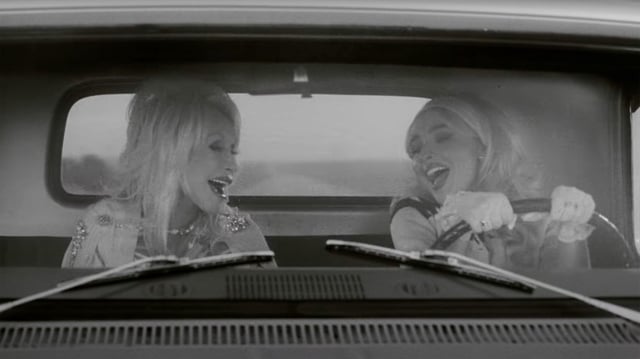 Dolly Parton and Sabrina Carpenter in the music video for "Please Please Please ft. Dolly Parton."