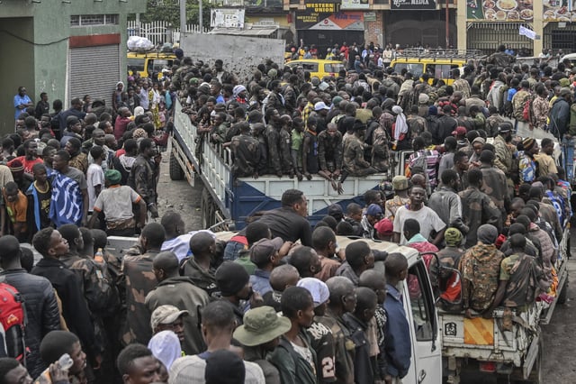 FILE - M23 rebels escort government soldiers and police who surrendered to an undisclosed location in Goma, Democratic republic of the Congo, Thursday, Jan. 30, 2025.(AP Photo/Moses Sawasawa, File)