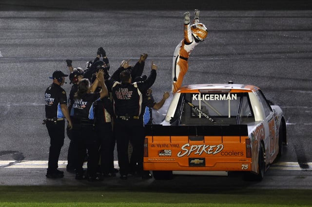 Parker Kligerman, driver of the #75 Spiked Coolers Chevrolet celebrates with his crew after winning the NASCAR Craftsman Truck Series Fresh from Florida 250 at Daytona International Speedway on February 14, 2025 in Daytona Beach, Florida.