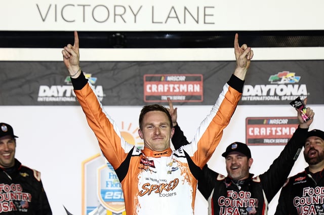 Parker Kligerman, driver of the #75 Spiked Coolers Chevrolet celebrates in victory lane after winning the NASCAR Craftsman Truck Series Fresh from Florida 250 at Daytona International Speedway on February 14, 2025 in Daytona Beach, Florida.