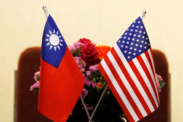 Flags of Taiwan and U.S. are placed for a meeting between U.S. House Foreign Affairs Committee Chairman Ed Royce speaks and with Su Chia-chyuan, President of the Legislative Yuan in Taipei, Taiwan March 27, 2018. REUTERS/Tyrone Siu/File Photo