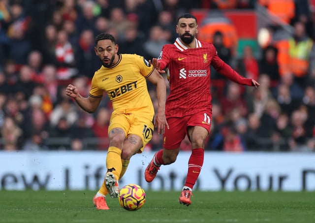 Soccer Football - Premier League - Liverpool v Wolverhampton Wanderers - Anfield, Liverpool, Britain - February 16, 2025 Wolverhampton Wanderers' Matheus Cunha in action with Liverpool's Mohamed Salah REUTERS/Phil Noble