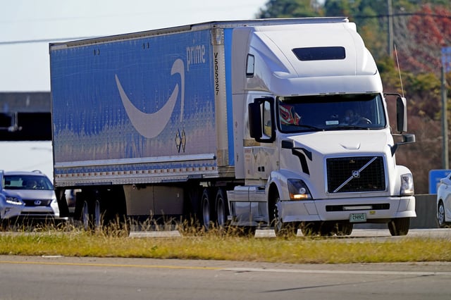 An Amazon Prime truck navigates Interstate 40 near Mebane, N.C., Tuesday, Nov. 30, 2021.