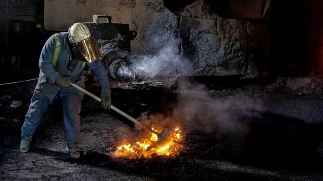 A worker at the Port Talbot plant in 2023. The steelworks have since been closed as it switches to electric arc furnace production