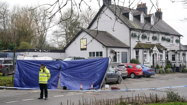 The woman, believed to be in her forties, died at the scene. Police are looking for one suspect