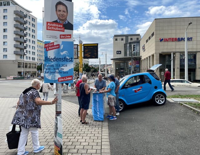 lternative for Germany (AfD) candidate for the Gera district Dieter Laudenbach talks to supporters at an AfD info stand in Gera, Germany, August 19, 2024.    REUTERS/Maria Martinez/File Photo