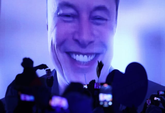 HALLE, GERMANY - JANUARY 25: Tech billionaire Elon Musk speaks live via a video transmission during the election campaign launch rally of the far-right Alternative for Germany (AfD) political party on January 25, 2025 in Halle, Germany. Musk is an outspoken supporter of the AfD and is urging German voters to cast their ballots for the party. The AfD is currently in second place in polls ahead of federal parliamentary snap elections scheduled for February 23. (Photo by Sean Gallup/Getty Images)