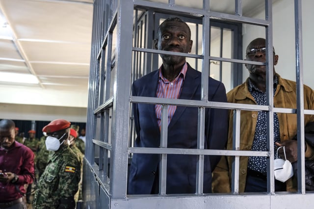 FILE - Ugandan opposition leader and four-time presidential candidate Kizza Besigye, stands in the dock at the Makindye Martial Court in Kampala, Uganda, Nov. 20. 2024. (AP Photo/Hajarah Nalwadda, File)