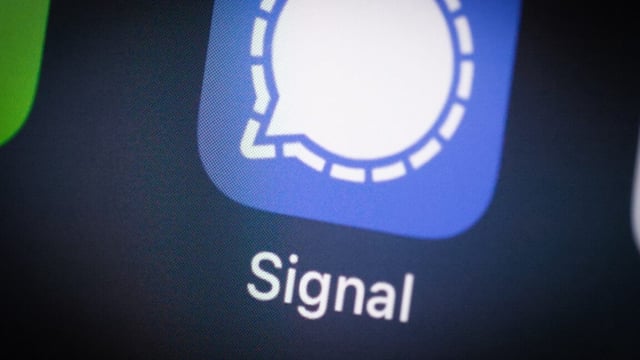 Signal app icon on an iOS device in close-up.