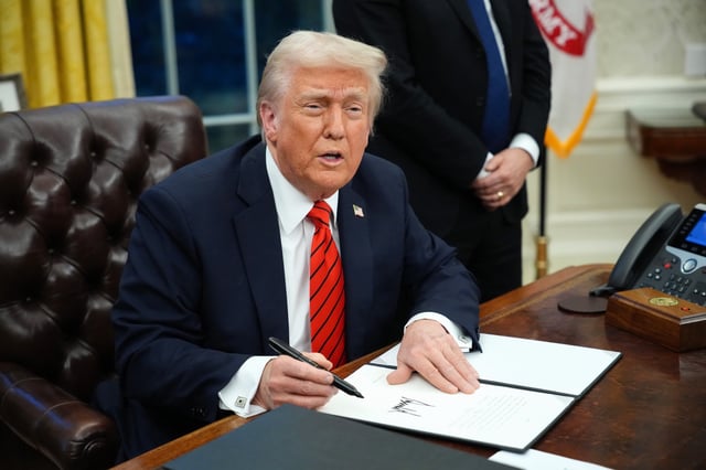 U.S. President Donald Trump signs a series of executive orders in the Oval Office at the White House on February 10, 2025 in Washington, DC.